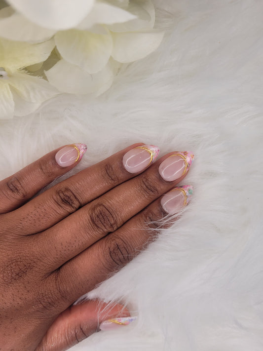 Hand with pink nail polish on a white background