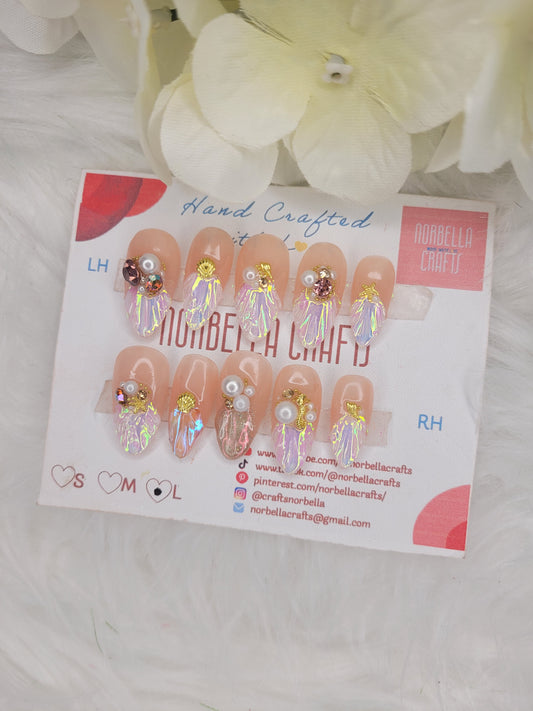Nail art display with decorative nails on a white background